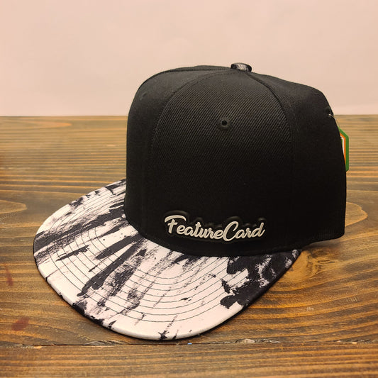 FeatureCard Hat black white paint splash Snap back